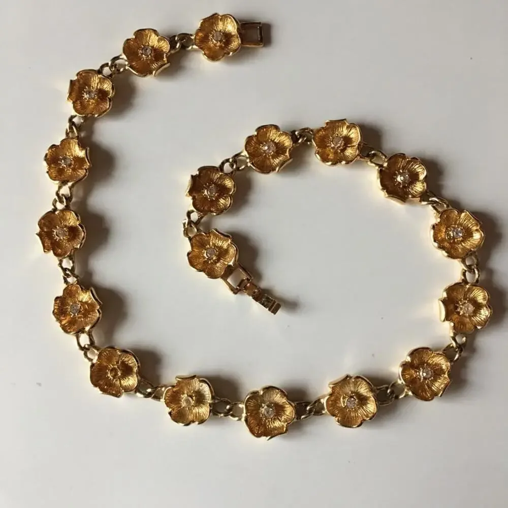 Vintage gold tone flower chain necklace with rhinestone accents